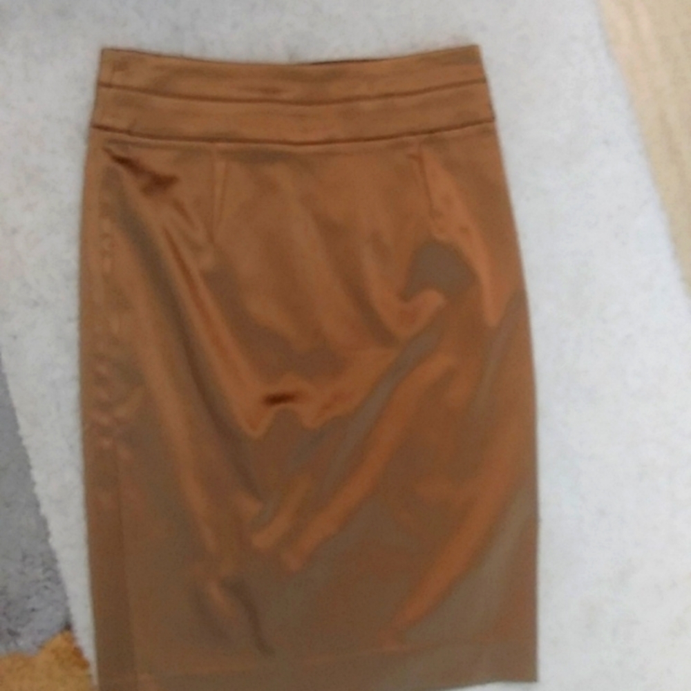BeBe Gold bodycon skirt. Size 6. Color Satan Gold. Used/As-Is. Amazingly skirt.